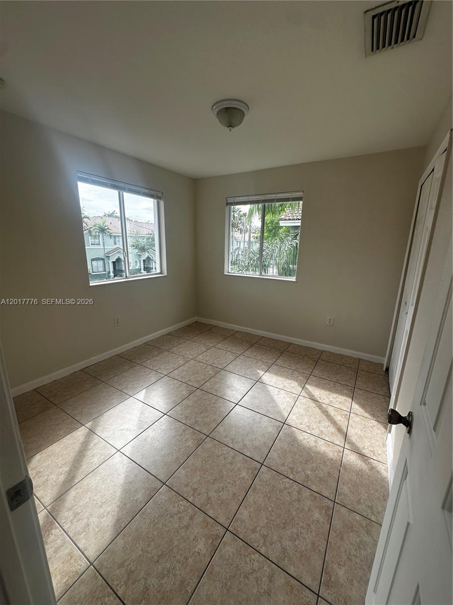 2907 Southeast 15th Road, Unit 67 Homestead, FL 33035 - Photo 24 of 25 a view of room with window and stairs
