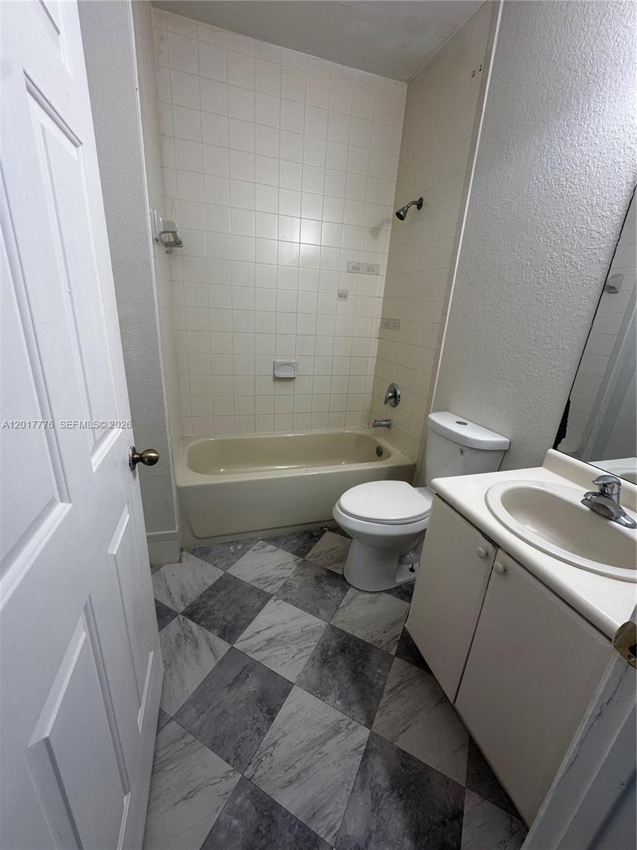 2907 Southeast 15th Road, Unit 67 Homestead, FL 33035 - Photo 8 of 25 a bathroom with a sink toilet and shower
