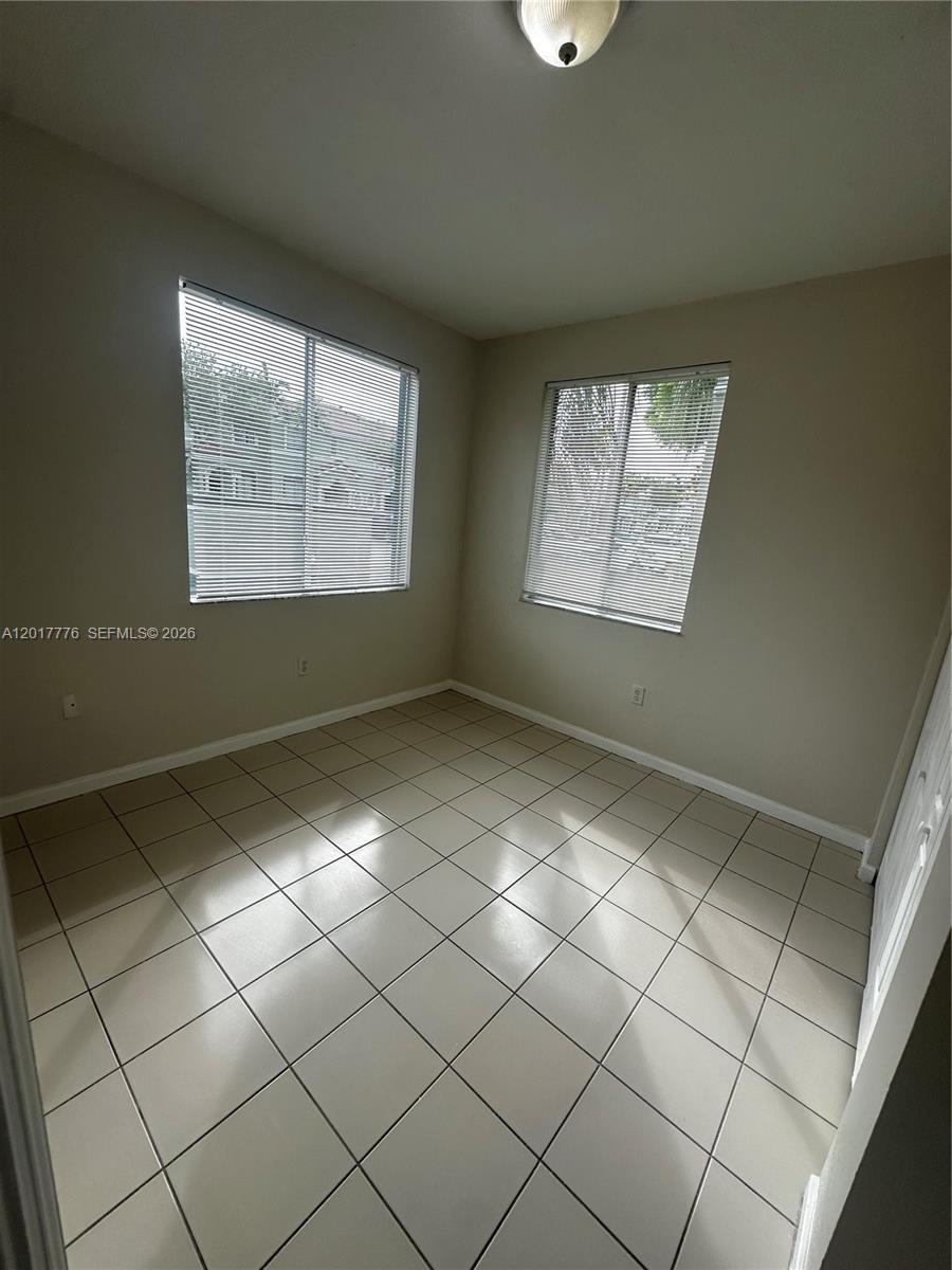 2907 Southeast 15th Road, Unit 67 Homestead, FL 33035 - Photo 9 of 25 a view of an empty room and window