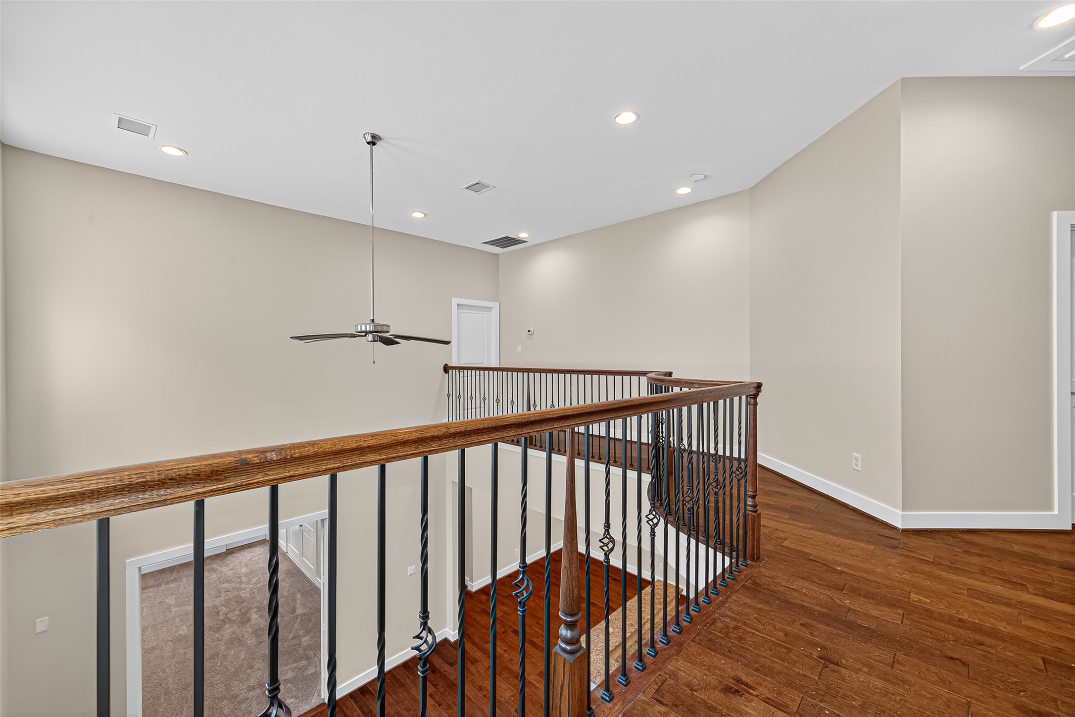 9508 Cedarpost Square Street Houston, TX 77055 - Photo 13 of 30 a view of hallway with wooden floor