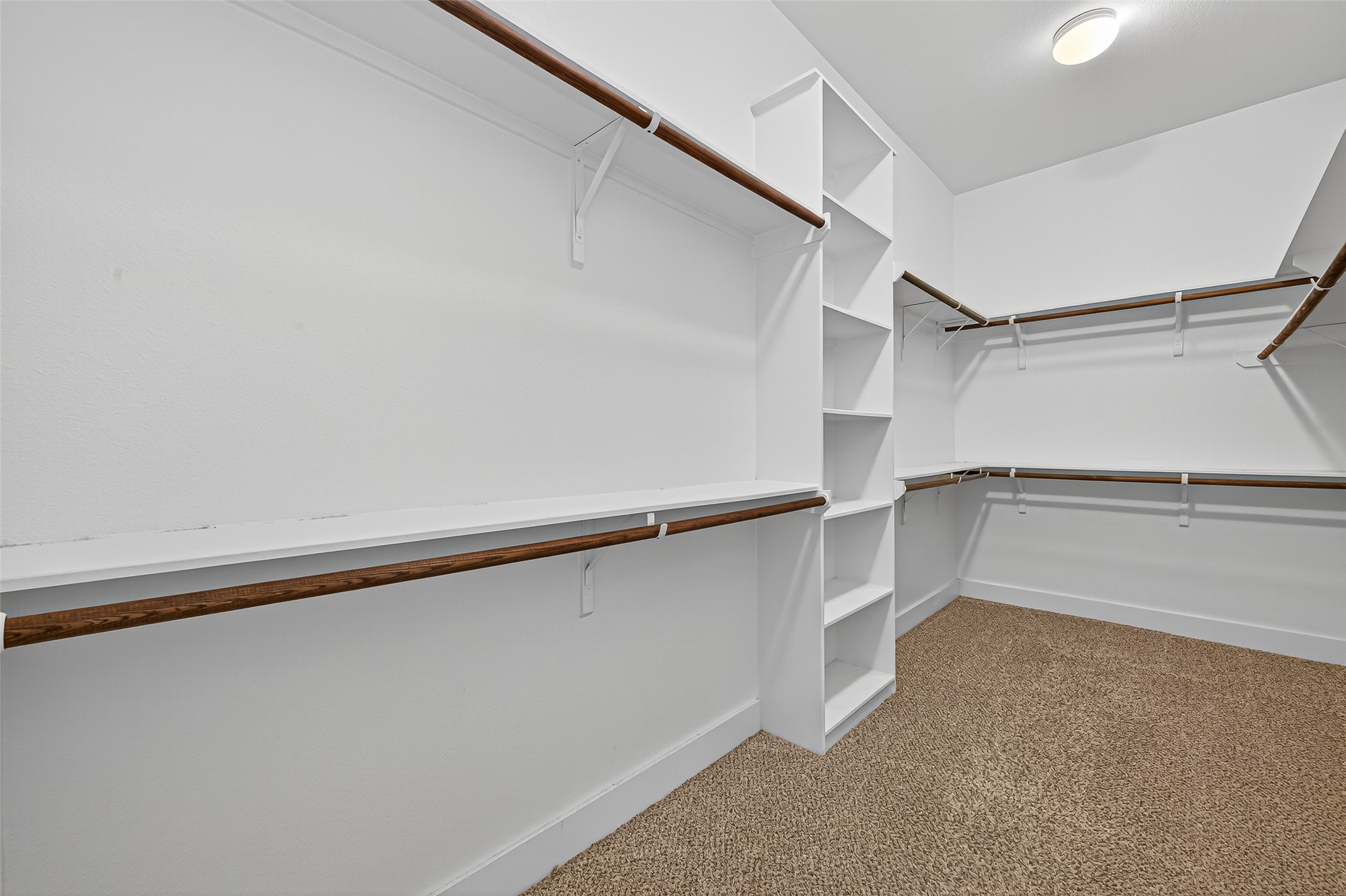 9508 Cedarpost Square Street Houston, TX 77055 - Photo 17 of 30 a view of an empty walk in closet