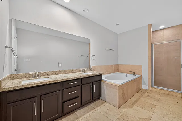 a bathroom with a bathtub and a shower