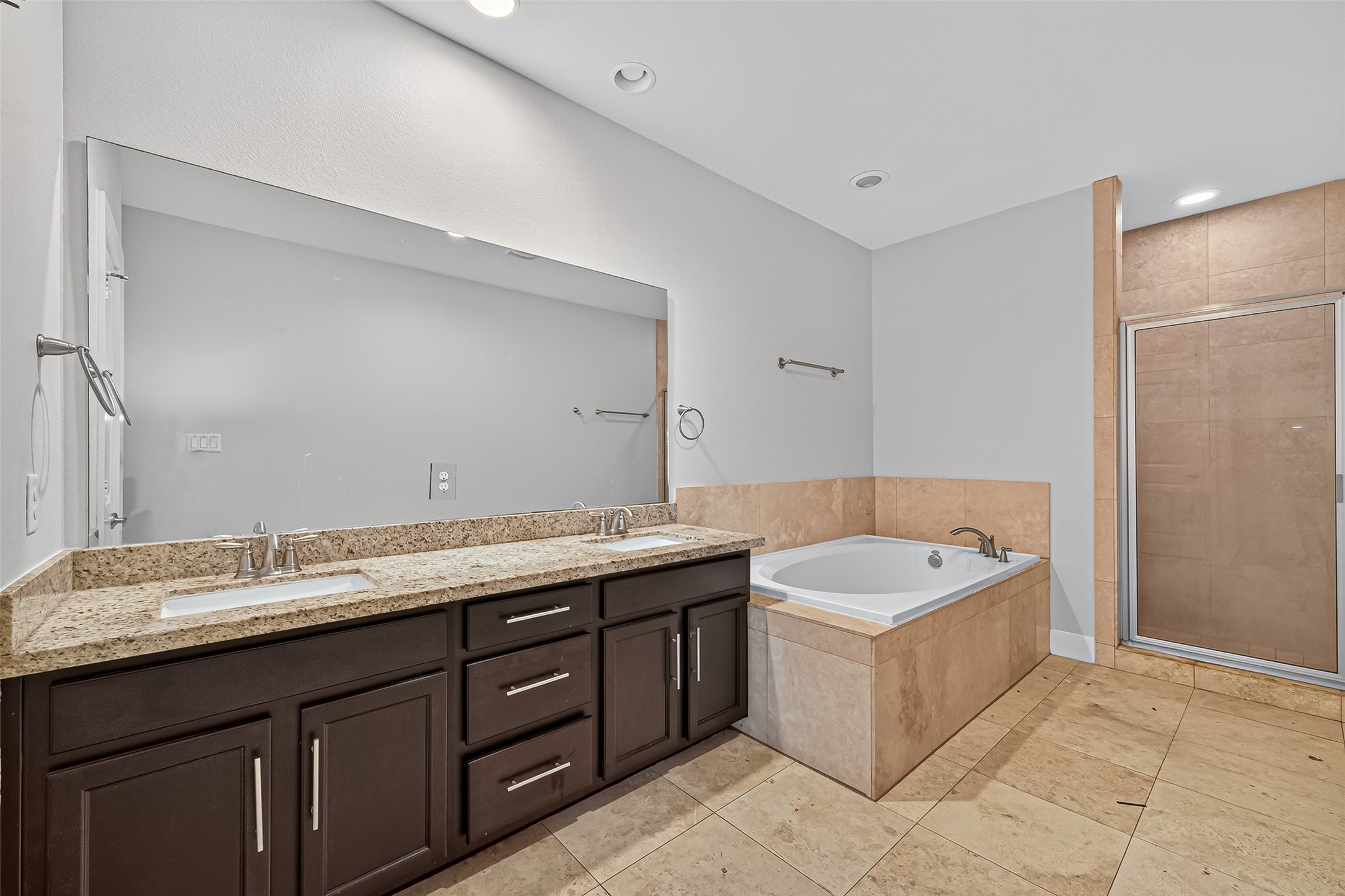 9508 Cedarpost Square Street Houston, TX 77055 - Photo 18 of 30 a spacious bathroom with a granite countertop double vanity sink mirror and bathtub