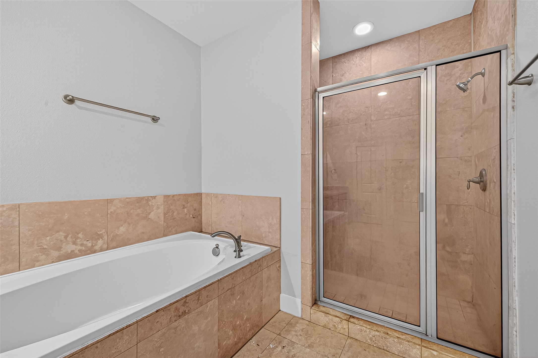 9508 Cedarpost Square Street Houston, TX 77055 - Photo 19 of 30 a bathroom with a bathtub and a shower