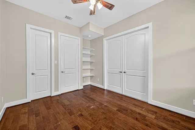a bathroom with a granite countertop sink toilet a large mirror and shower
