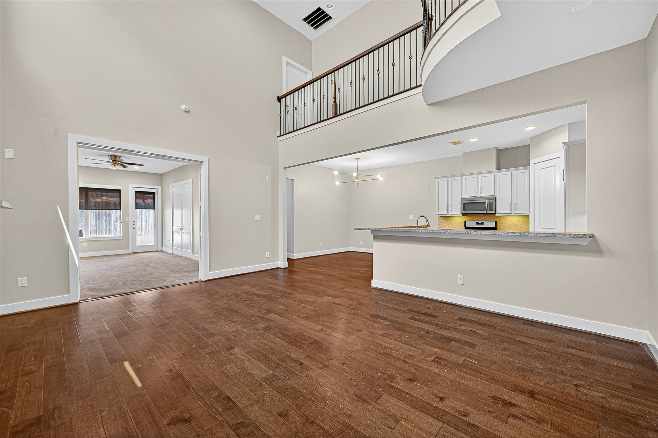 9508 Cedarpost Square Street Houston, TX 77055 - Photo 5 of 30 a view of a kitchen with furniture and wooden floor