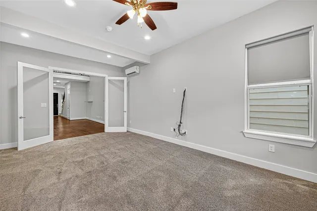 a view of an empty room with a window