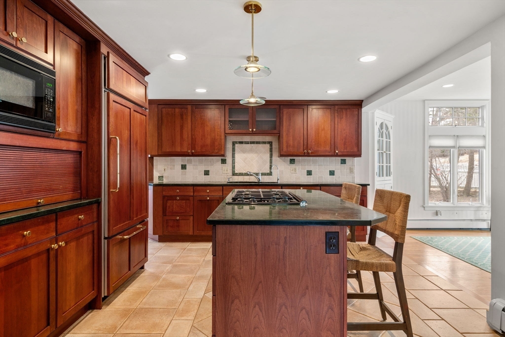 6 Earle Road Wellesley, MA 02481 - Photo 15 of 33 a kitchen with a stove a refrigerator and a microwave