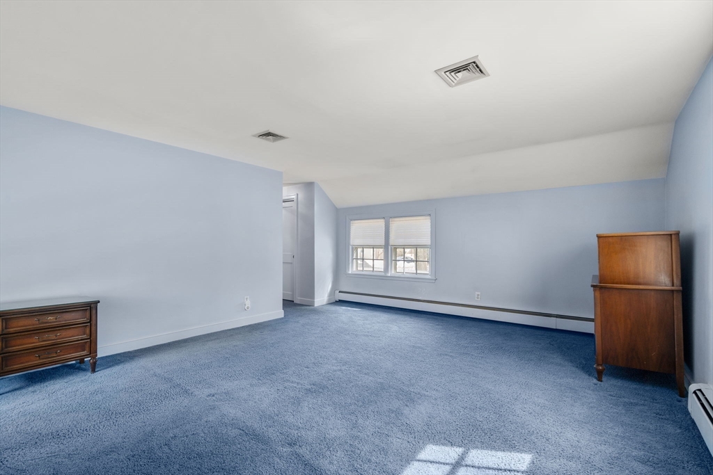 6 Earle Road Wellesley, MA 02481 - Photo 19 of 33 a view of an empty room with a window