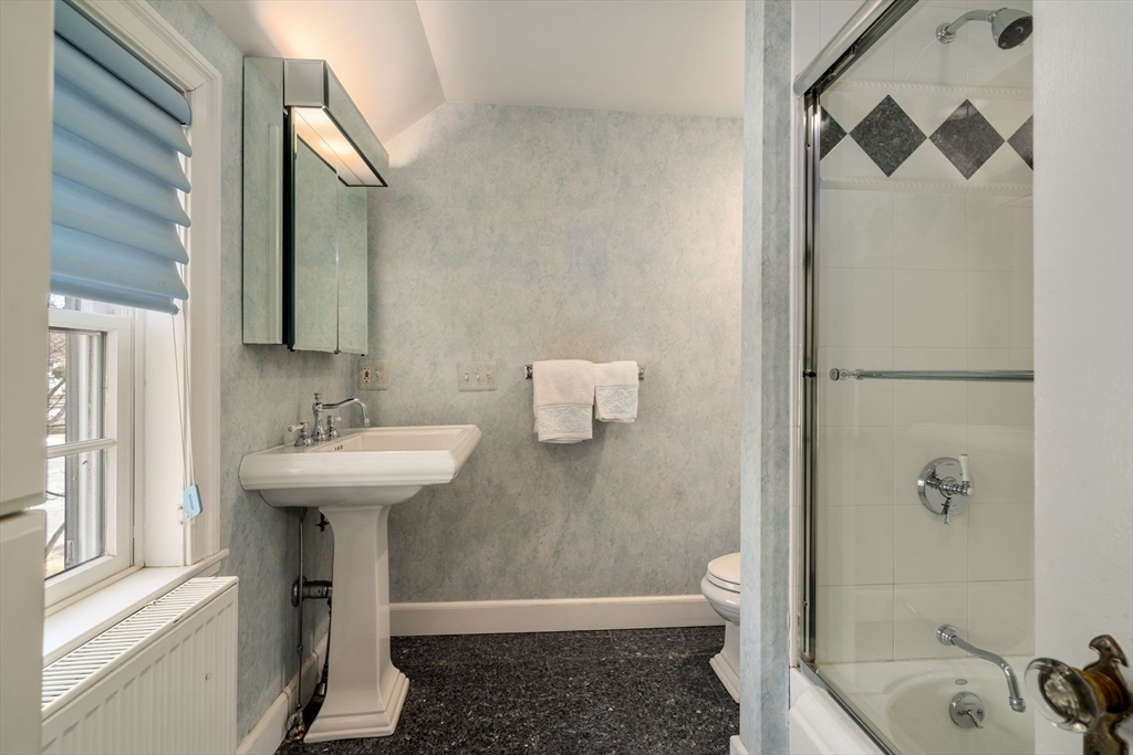 6 Earle Road Wellesley, MA 02481 - Photo 25 of 33 a bathroom with a sink and a mirror