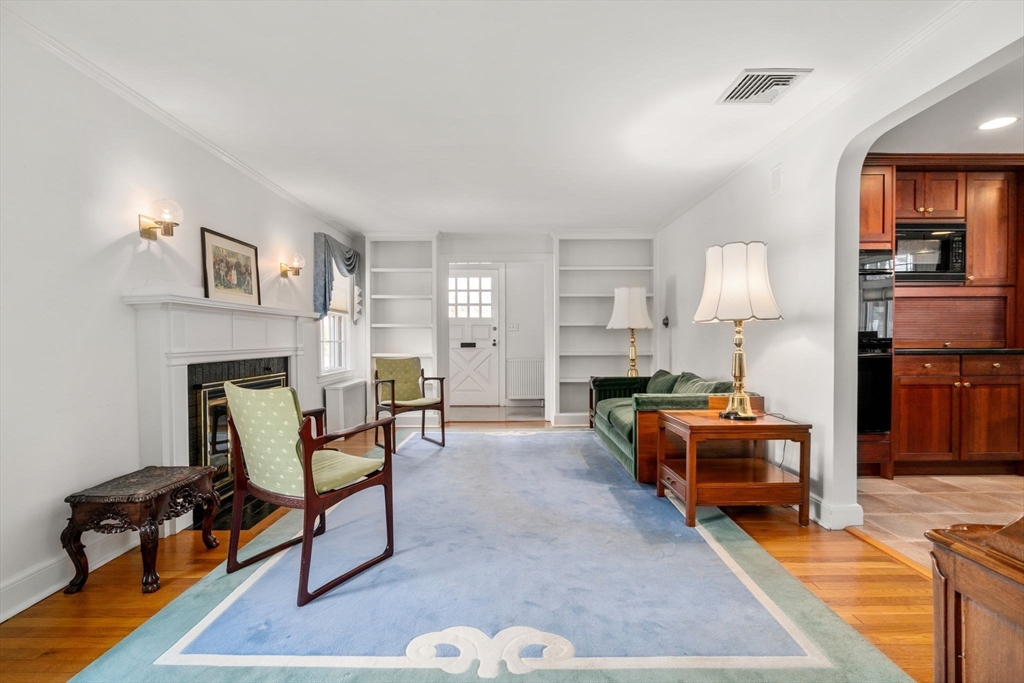 6 Earle Road Wellesley, MA 02481 - Photo 3 of 33 a living room with furniture and a fireplace