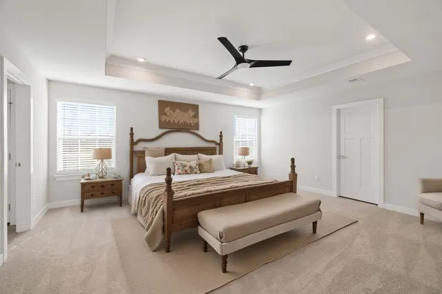 a bedroom with a bed and window