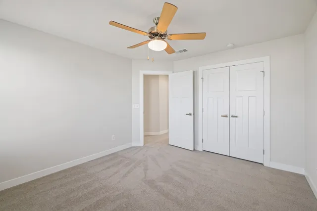 a spacious bathroom with a double vanity sink mirror and next to a window