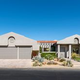 a kitchen with a stove a sink and a microwave