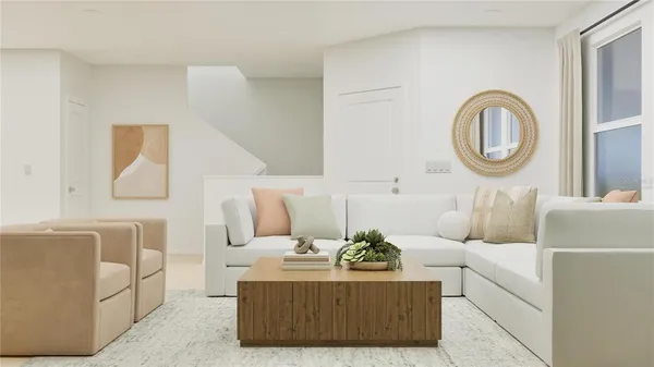 a living room with furniture a mirror and white walls