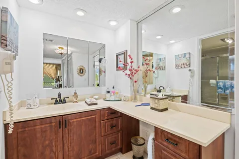 a bathroom with a sink double vanity and a mirror