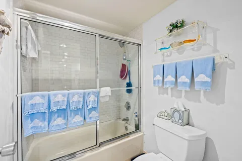 a bathroom with a sink a mirror and a shower