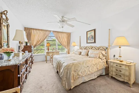 a bed room with a bed and a chandelier