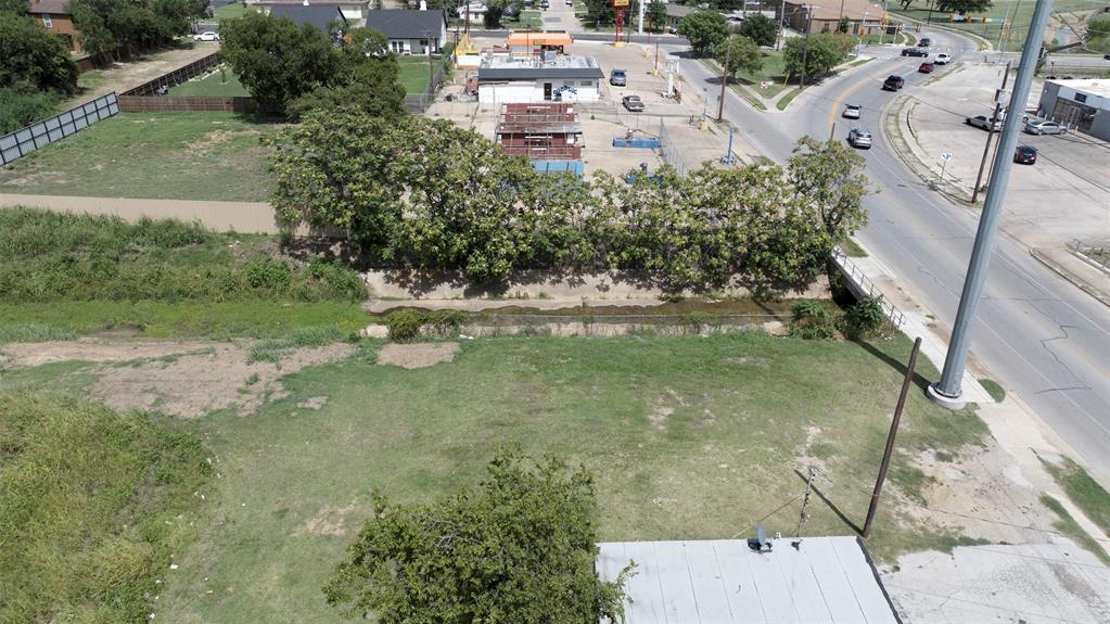 5417 Ramey Avenue Fort Worth, TX 76105 - Photo 4 of 6 an aerial view of a house with a yard and lake view