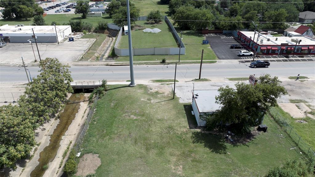 5417 Ramey Avenue Fort Worth, TX 76105 - Photo 5 of 6 an aerial view of a house with a garden and lake view