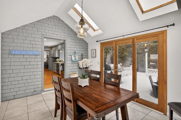 a kitchen with stainless steel appliances granite countertop a refrigerator a stove and a sink