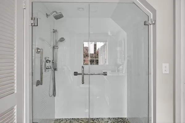 a view of a room with wooden floor and window
