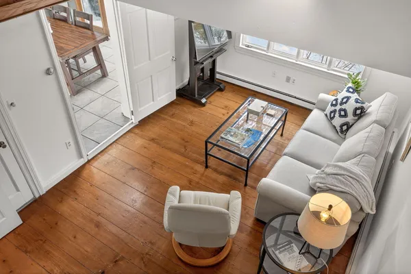 a living room with furniture and a large window