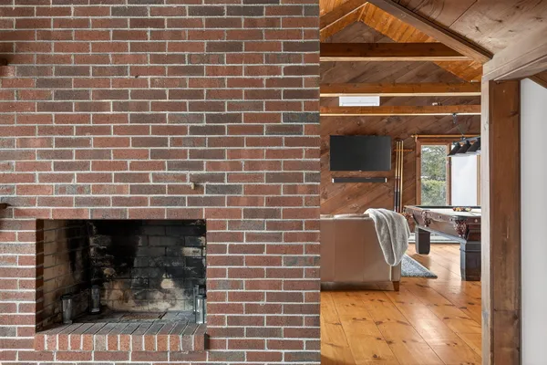 a aerial view of a house with swimming pool and large trees