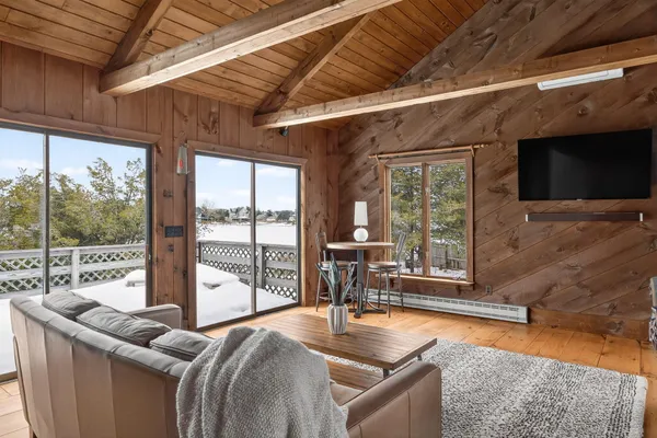an aerial view of a house with a ocean view
