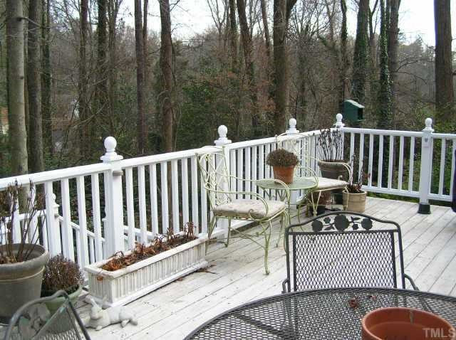 2818 Exeter Circle Raleigh, NC 27608 - Photo 10 of 10 Private deck overlooks huge landscaped back yard. Two car carport under deck area. Other