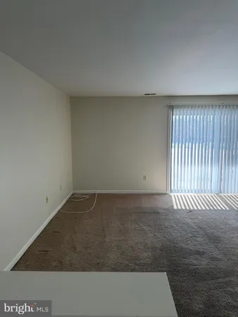 an empty room with wooden floor