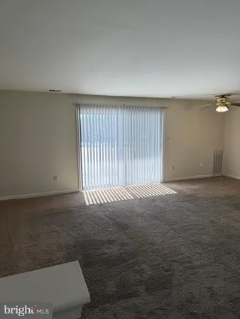 an empty room with wooden floor