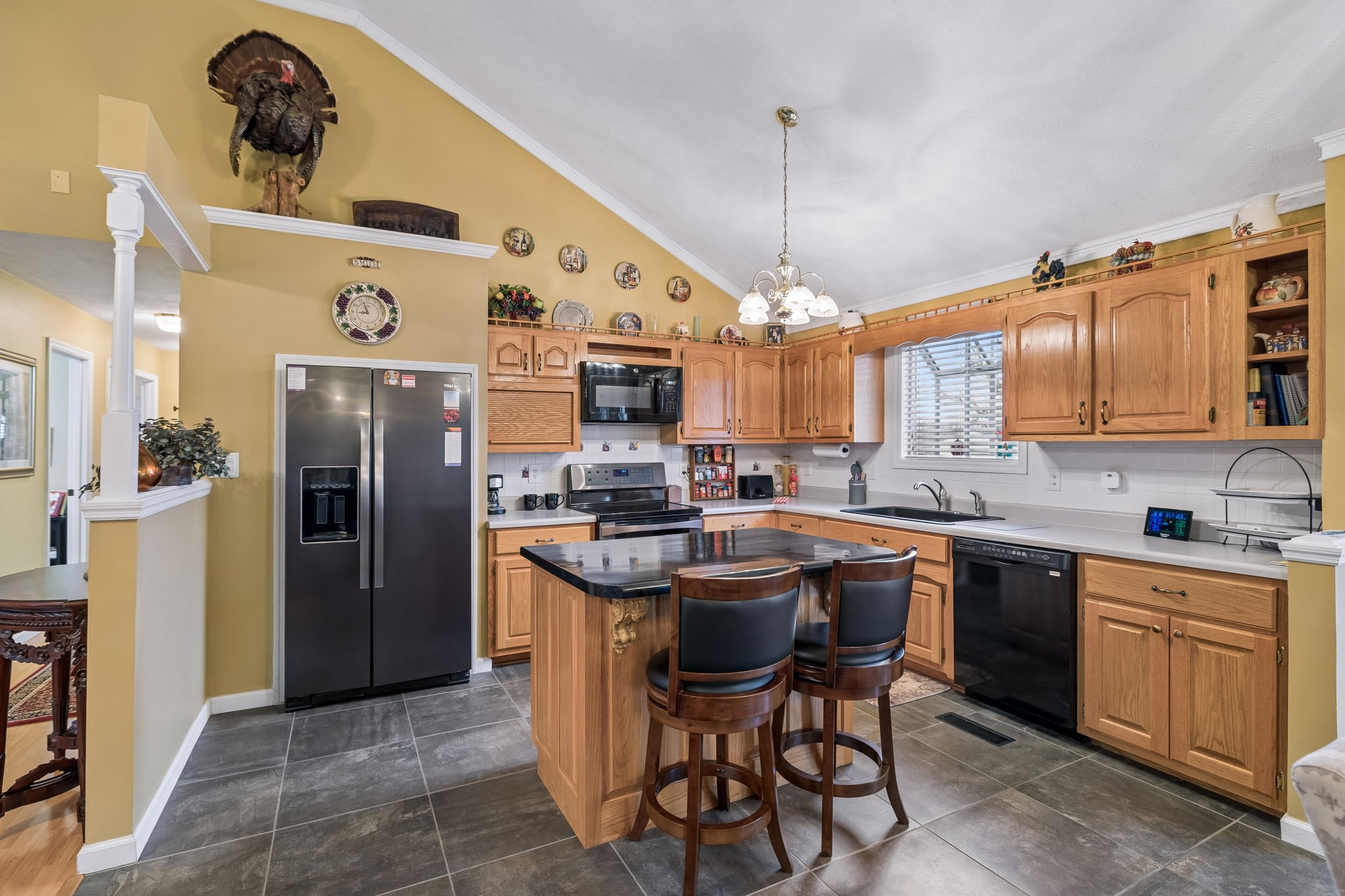 165 Pond Creek Road Summertown, TN 38483 - Photo 27 of 79 a kitchen with stainless steel appliances granite countertop a sink a stove and refrigerator