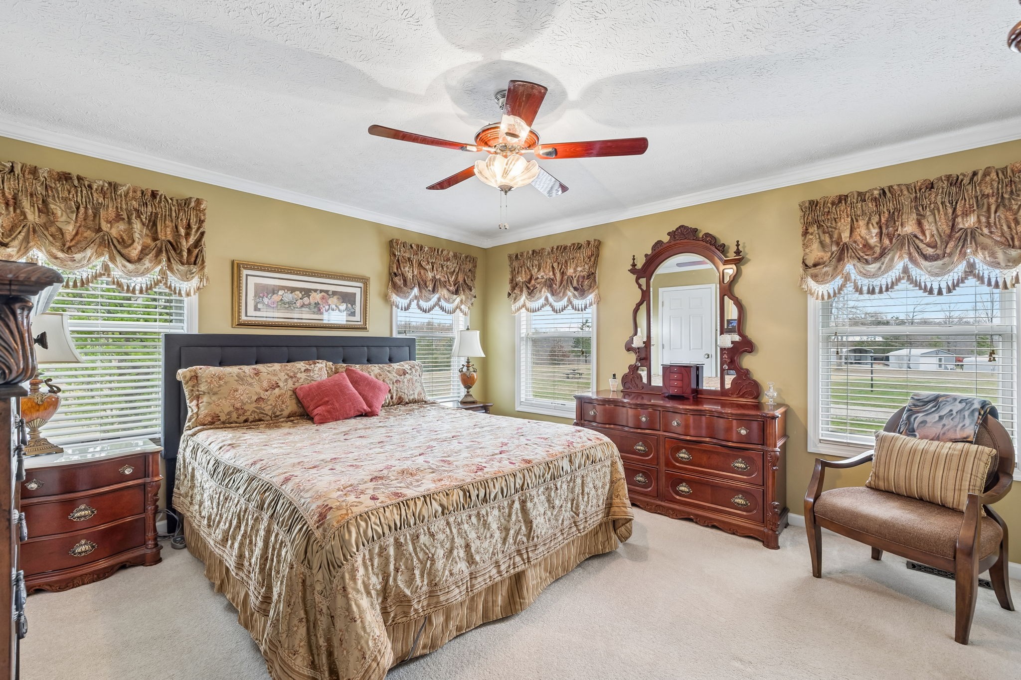 165 Pond Creek Road Summertown, TN 38483 - Photo 41 of 79 a bedroom with a bed and a chandelier