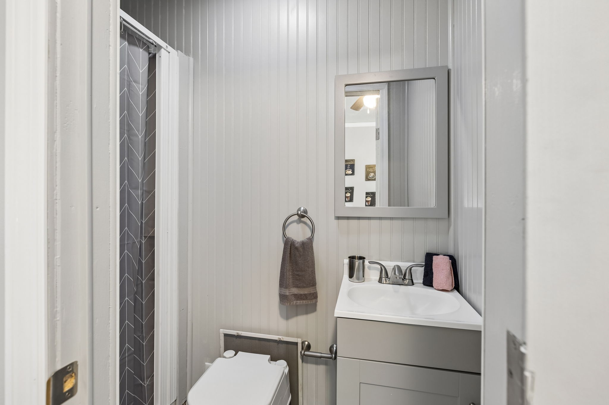 165 Pond Creek Road Summertown, TN 38483 - Photo 52 of 79 a bathroom with a toilet sink and mirror