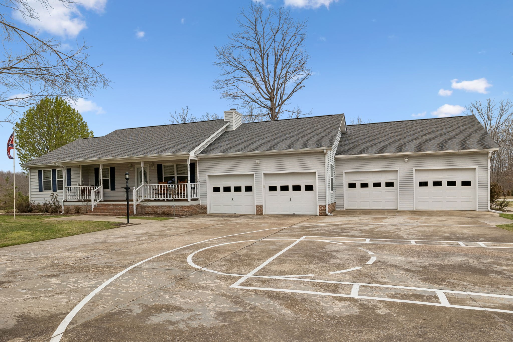 165 Pond Creek Road Summertown, TN 38483 - Photo 7 of 79 a white house with a large tree and yard in front of it
