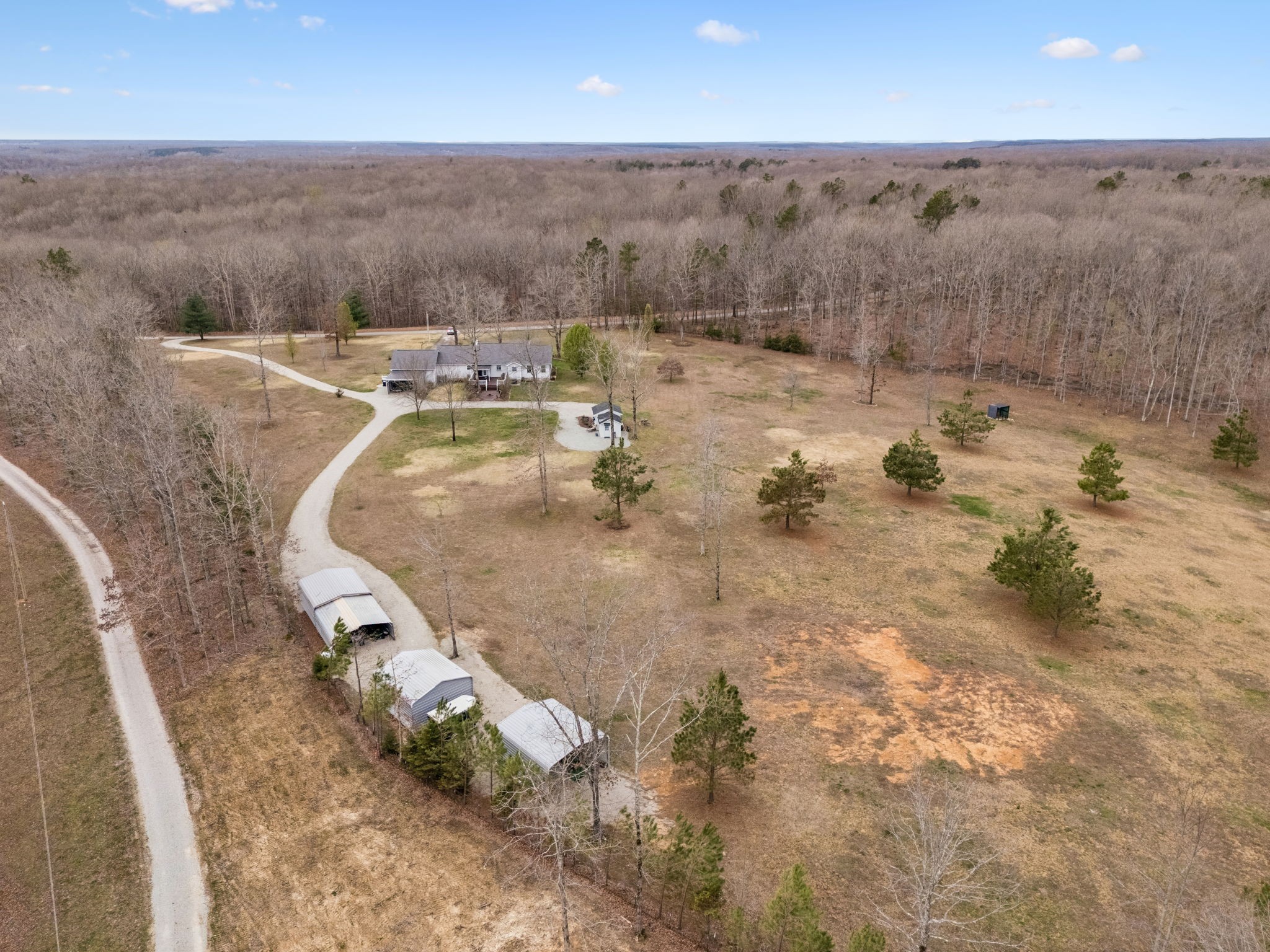 165 Pond Creek Road Summertown, TN 38483 - Photo 72 of 79 an aerial view of a house with a yard basket ball court