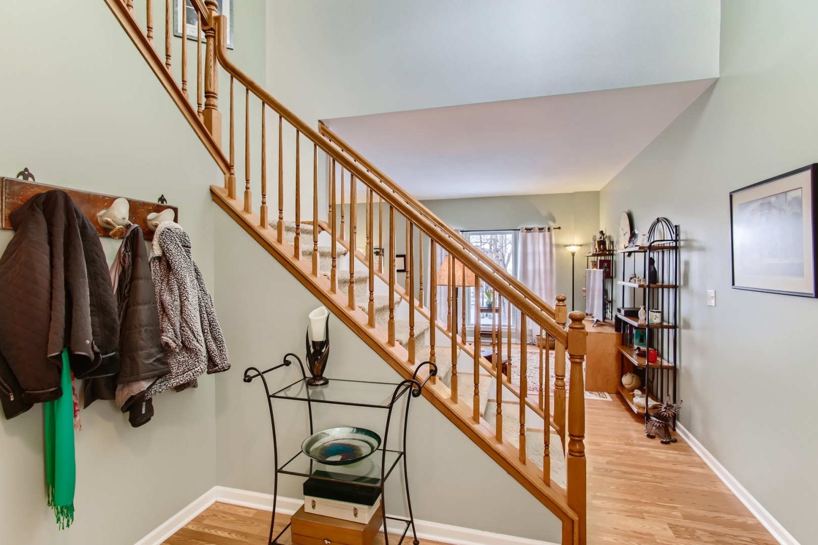 361 Ridge Road North Aurora, IL 60542 - Photo 5 of 34 a view of staircase with lots of frames on wall and wooden floor