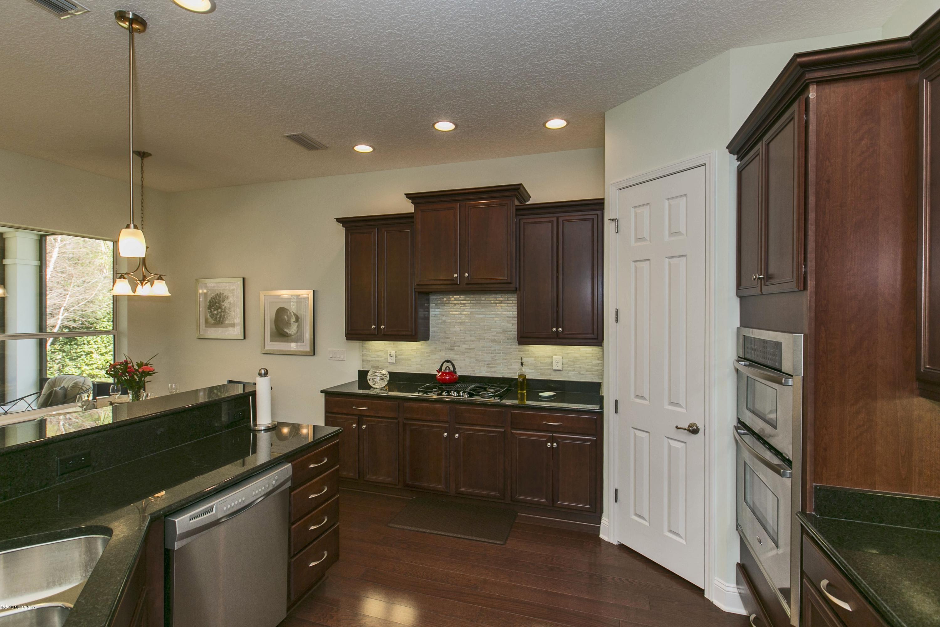 86 Pelican Pointe Road Ponte Vedra, FL 32081 - Photo 6 of 61 a kitchen with stainless steel appliances a sink stove and refrigerator