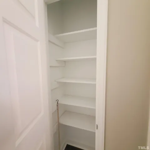 a view of an empty walk in closet