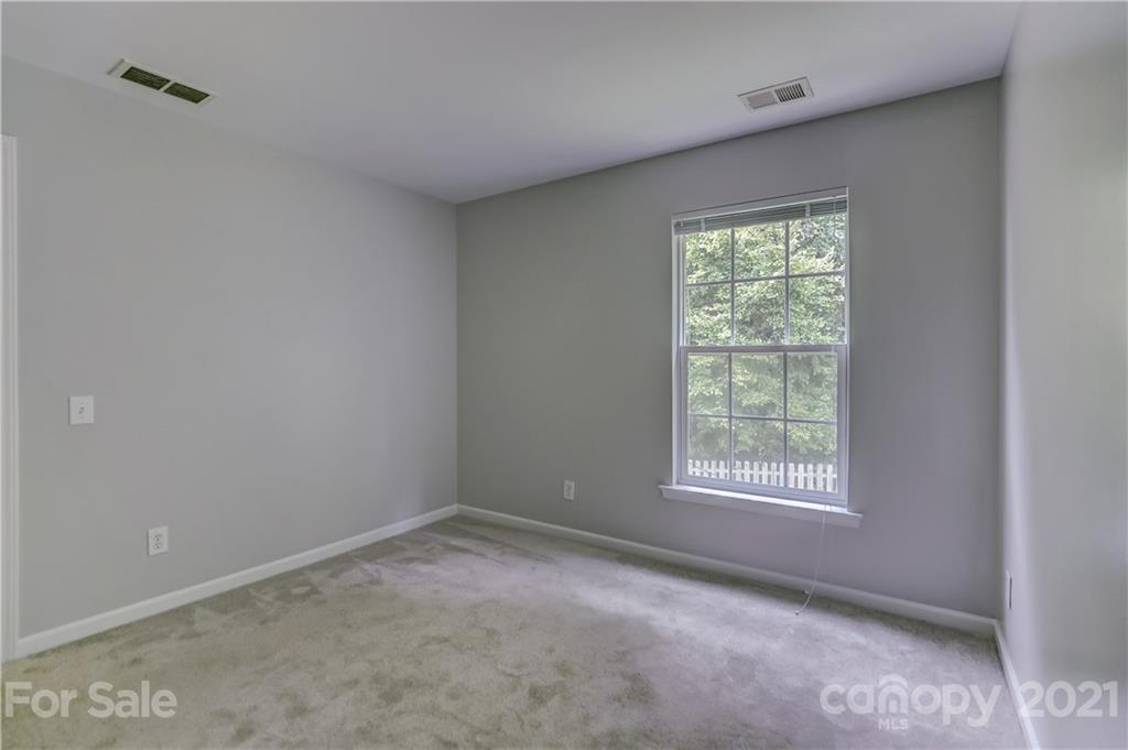 10208 Roundleaf Drive Charlotte, NC 28213 - Photo 17 of 26 an empty room with a window