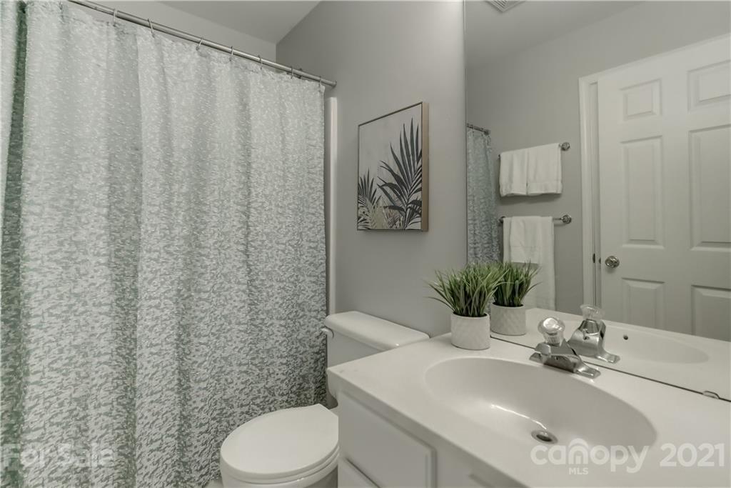 10208 Roundleaf Drive Charlotte, NC 28213 - Photo 19 of 26 a bathroom with a sink toilet and shower