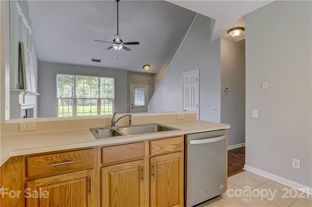 10208 Roundleaf Drive Charlotte, NC 28213 - Photo 10 of 26 a kitchen with a sink cabinets and window