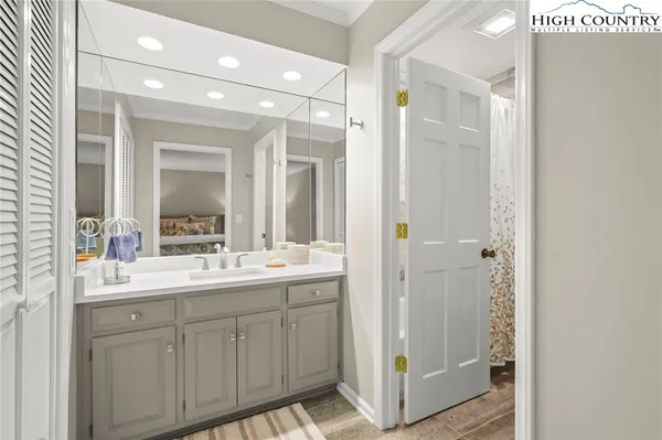 a bathroom with a double vanity sink mirror and double