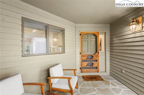 a view of an entryway with wooden floor