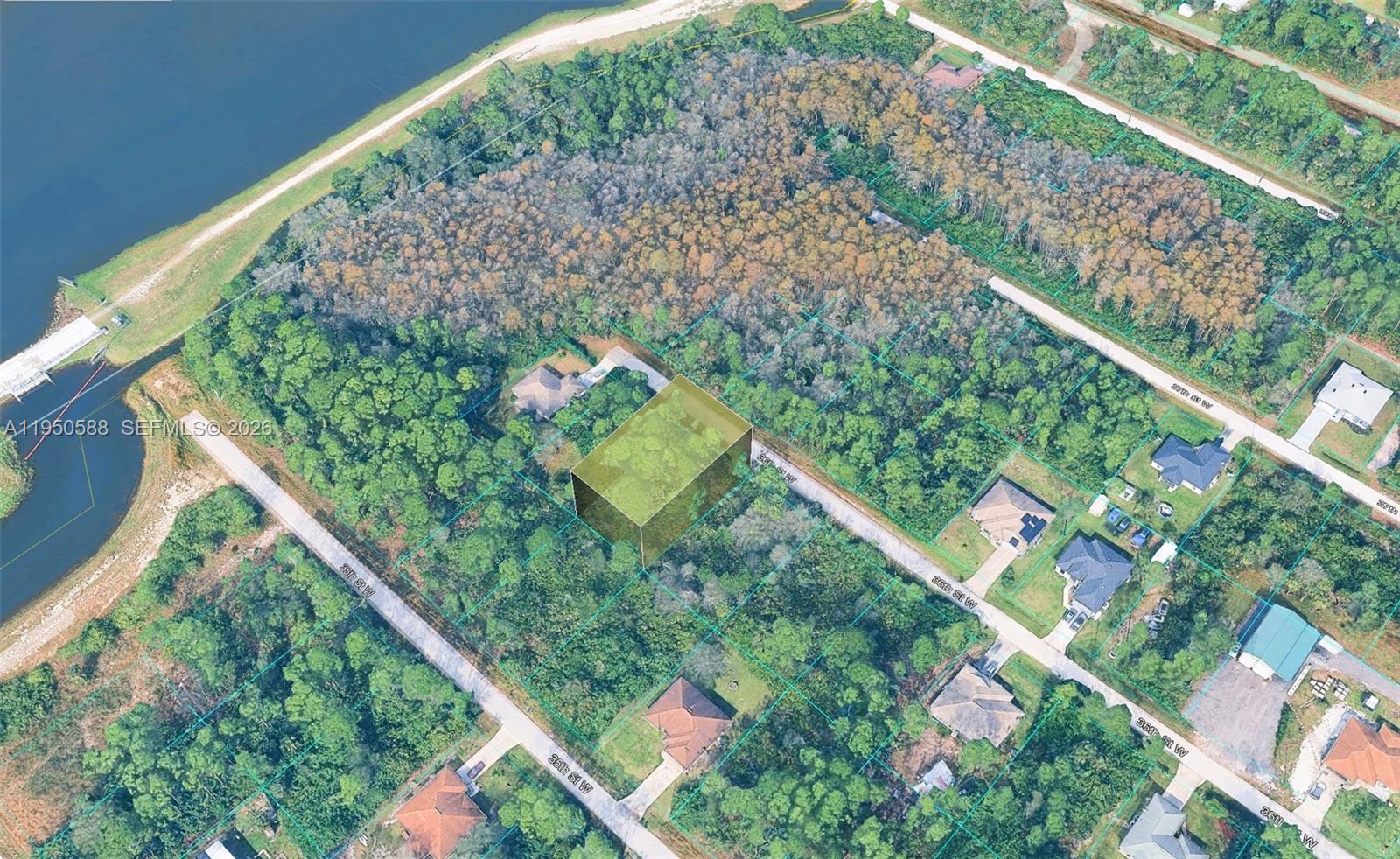 3315 36th Street West Lehigh Acres, FL 33971 - Photo 2 of 6 a picture of trees in front of a yard