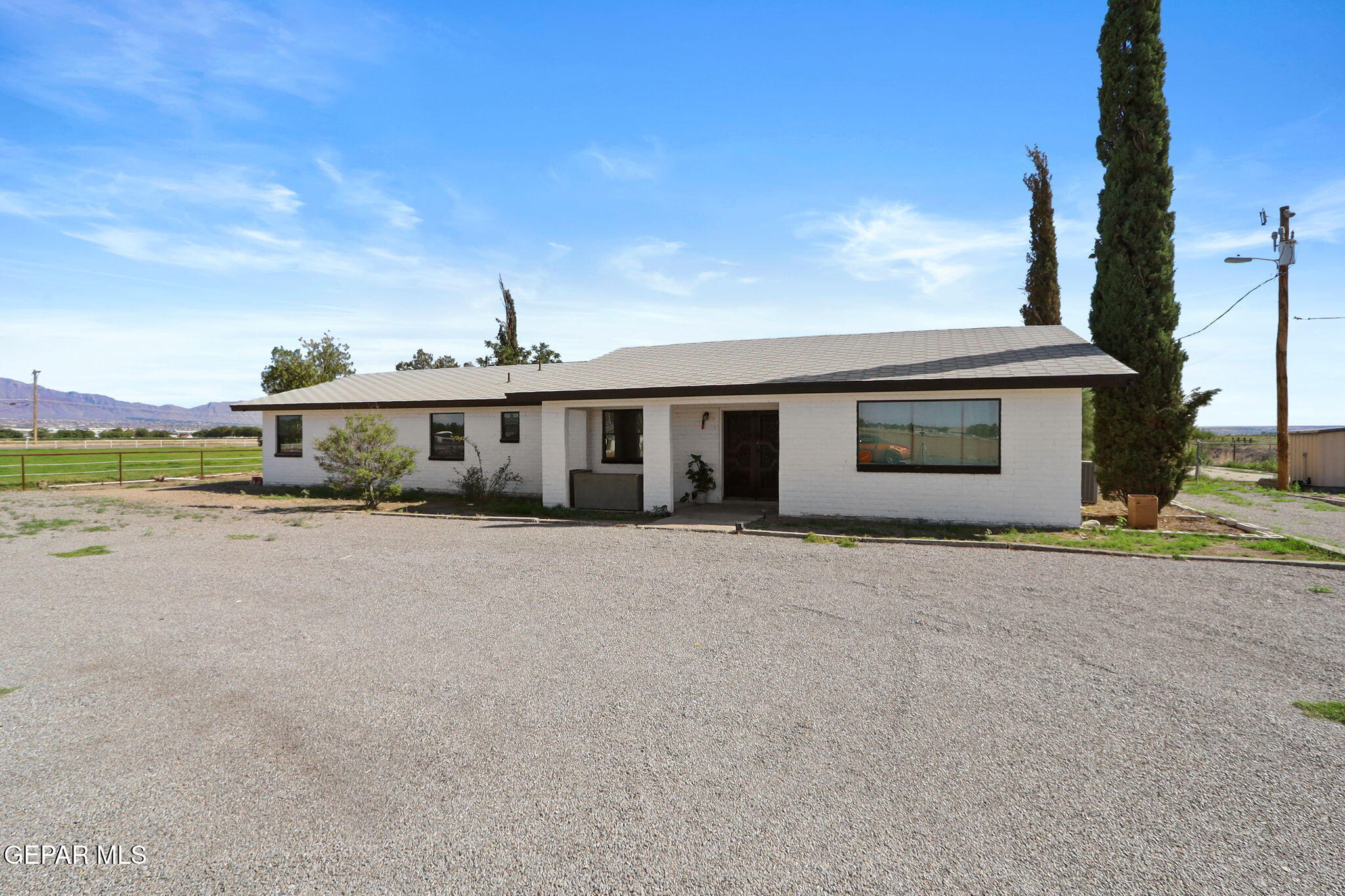810 Gato Road El Paso, TX 79932 - Photo 4 of 73 a front view of a house with a yard and lake view