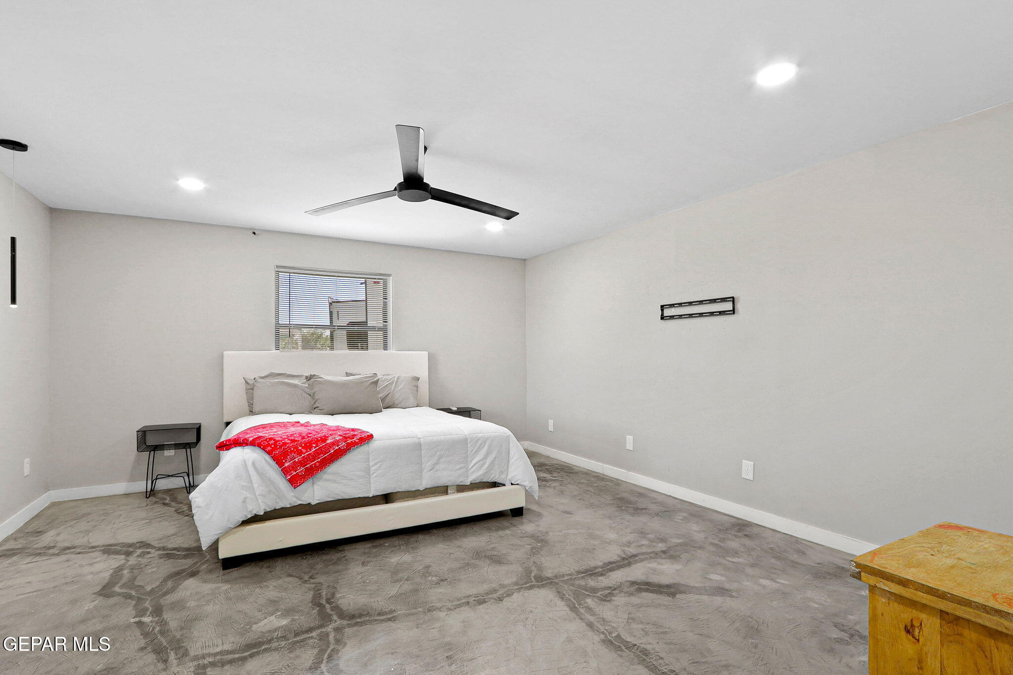 810 Gato Road El Paso, TX 79932 - Photo 42 of 73 a bedroom with a bed and a potted plant