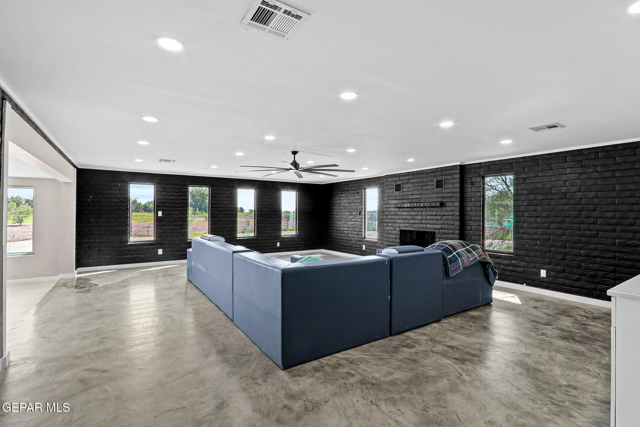 810 Gato Road El Paso, TX 79932 - Photo 50 of 73 a living room with furniture a flat screen tv and a large window