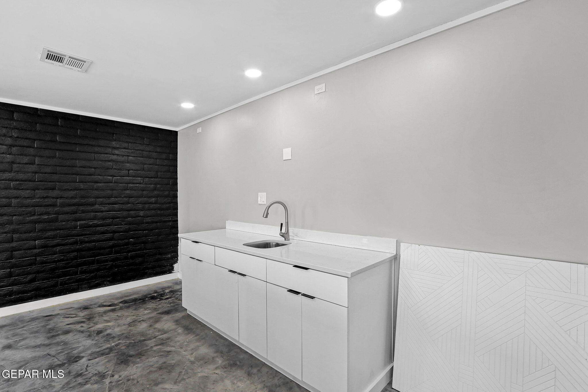 810 Gato Road El Paso, TX 79932 - Photo 51 of 73 a bathroom with a sink and a mirror